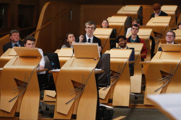 School children debating in Scottish Parliament debating chamber
